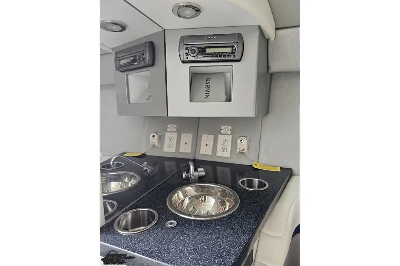 Slide: The Image of 2009 Formula 353 FASTech cabin interior with sink, stereo, and Garmin navigation system. - 81
