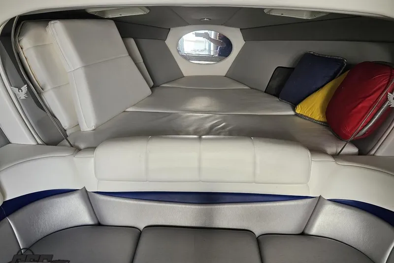 Slide: The Image of 2009 Formula 353 FASTech cabin interior with cushioned seating and colorful pillows. - 84