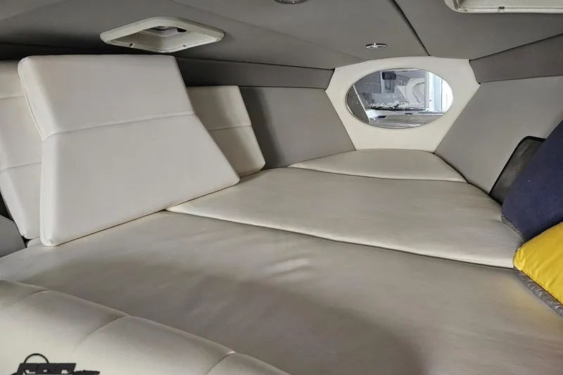 Slide: The Image of 2009 Formula 353 FASTech cabin interior with white cushioned seating and small window. - 85