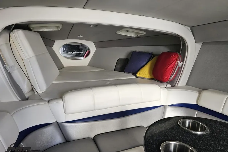 Slide: The Image of Interior of 2009 Formula 353 FASTech boat with plush seating and colorful cushions. - 87