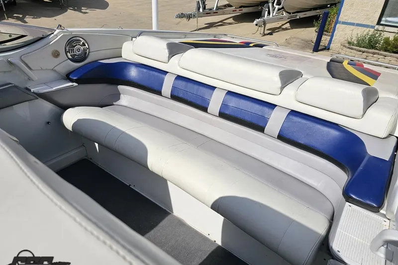 Slide: The Image of 2009 Formula 353 FASTech boat interior with blue and white seating. - 91