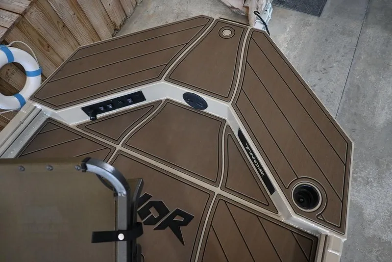 Slide: The Image of Thor 1900 boat deck, 2026 model, featuring brown paneling and control panel. - 5