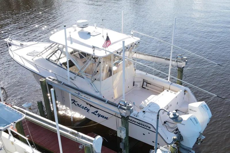 The Image of 2010 Grady-White Express 330 boat docked with twin Mercury engines. - 0