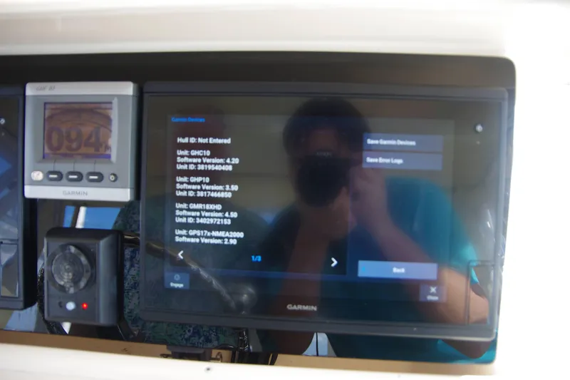 Slide: The Image of Garmin navigation system on 2010 Grady-White Express 330 boat dashboard. - 15