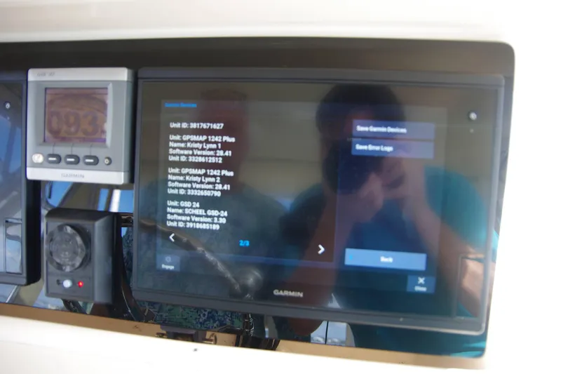 Slide: The Image of Garmin navigation system on 2010 Grady-White Express 330 boat dashboard. - 16