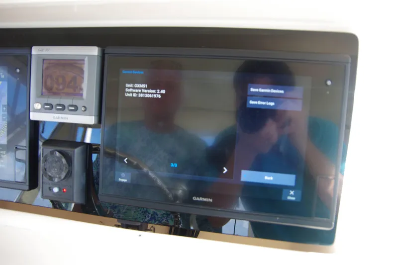 Slide: The Image of Garmin navigation system on 2010 Grady-White Express 330 boat dashboard. - 17