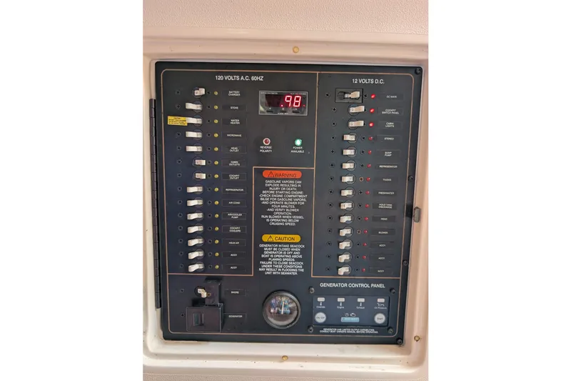 Slide: The Image of Electrical control panel on a 2010 Grady-White Express 330 boat. - 28