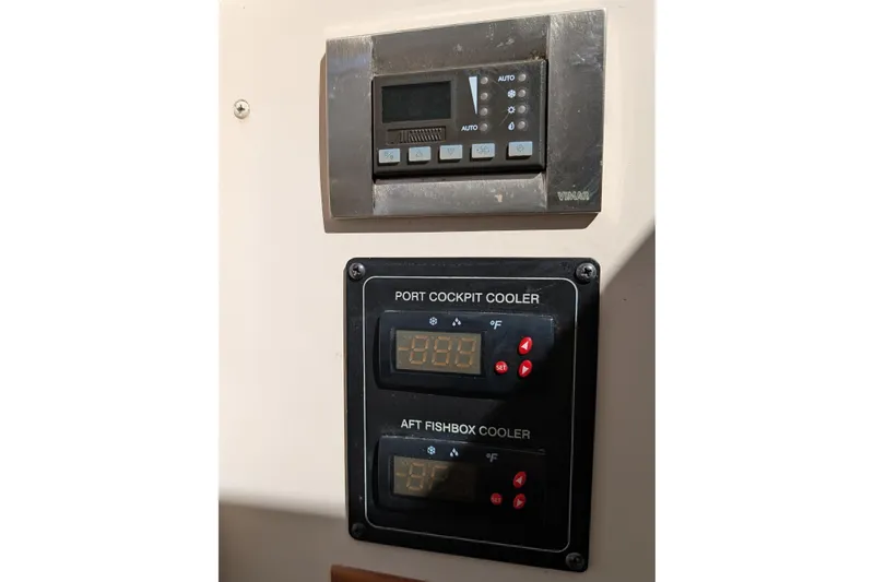 Slide: The Image of Control panel for coolers on a 2010 Grady-White Express 330 boat. - 29