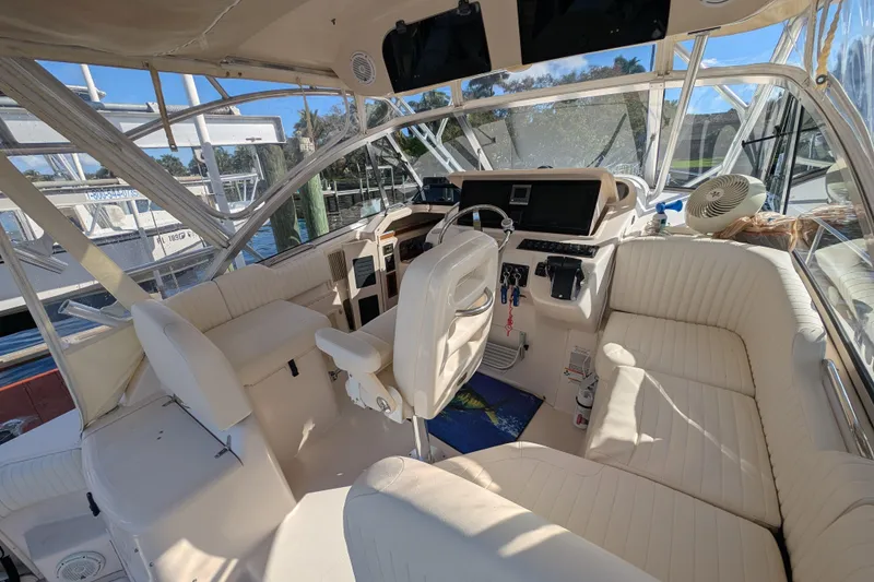 Slide: The Image of 2010 Grady-White Express 330 boat interior with helm, seating, and controls. - 34