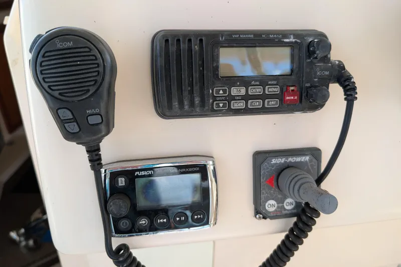 Slide: The Image of Control panel of a 2010 Grady-White Express 330 boat with communication devices. - 35