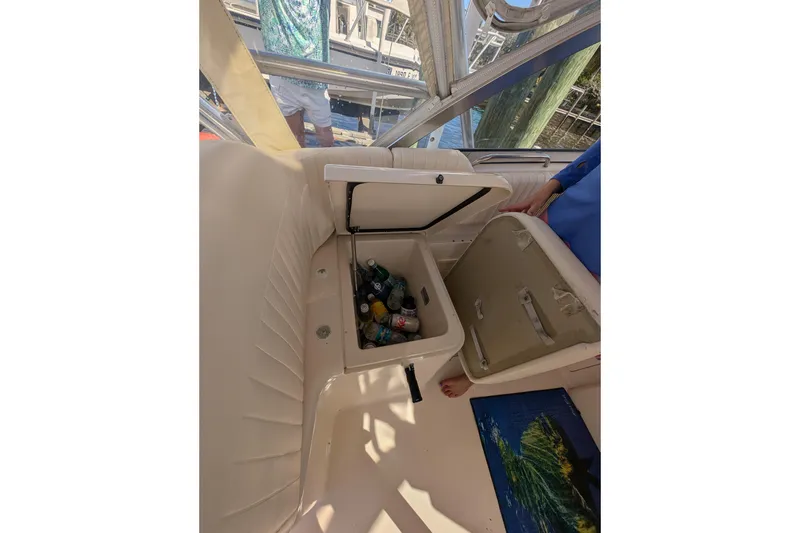 Slide: The Image of 2010 Grady-White Express 330 boat interior with open cooler containing drinks. - 38