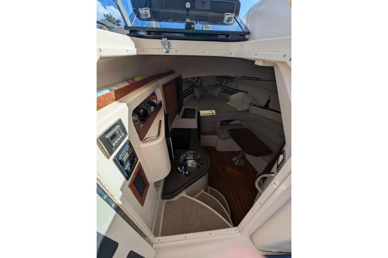 Slide: The Image of 2010 Grady-White Express 330 cabin interior with seating and control panels. - 39