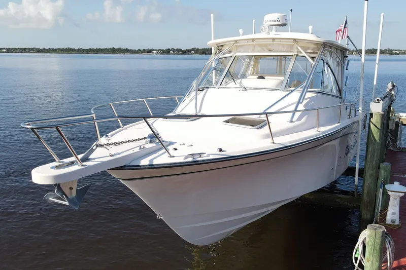 Slide: The Image of 2010 Grady-White Express 330 boat docked on calm water. - 4