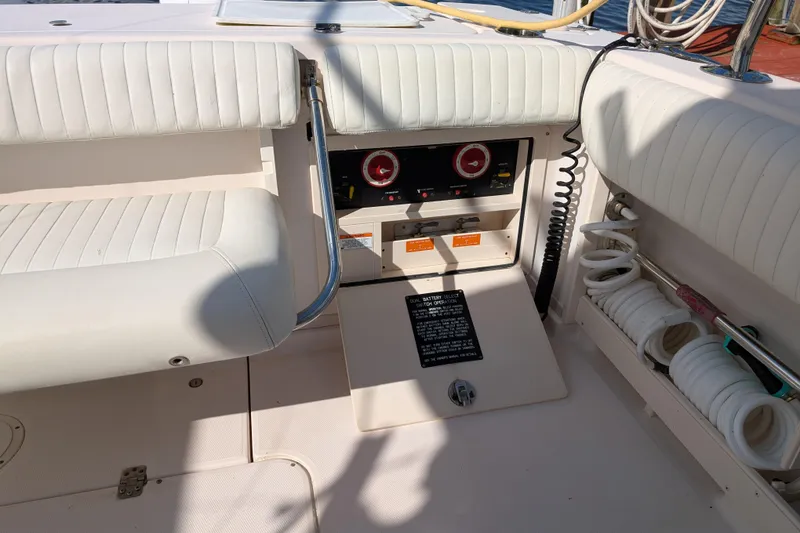 Slide: The Image of 2010 Grady-White Express 330 boat interior with seating and control panel. - 43