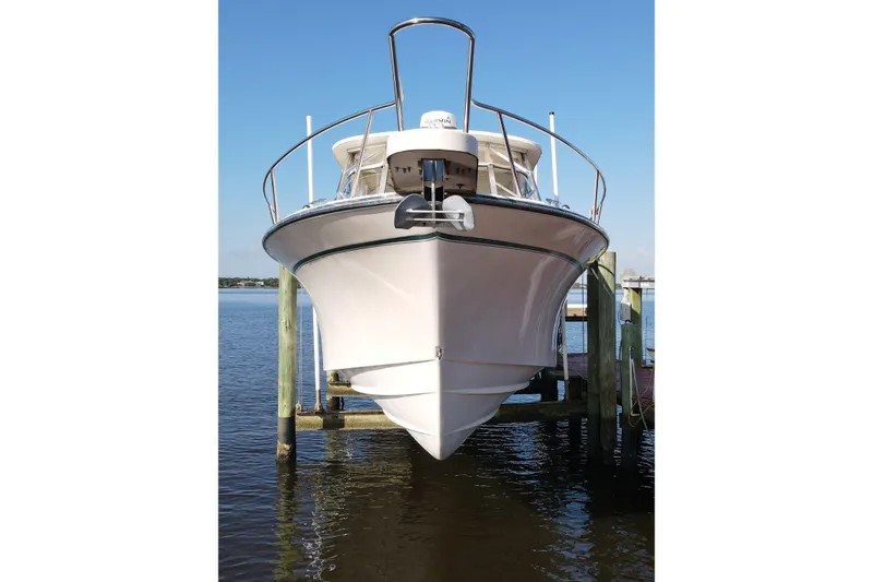 Slide: The Image of 2010 Grady-White Express 330 boat docked on a sunny day. - 6