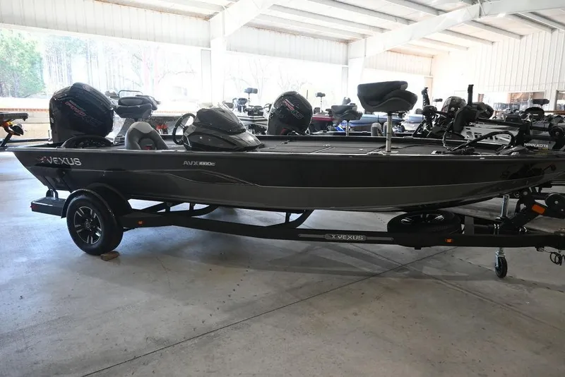 Slide: The Image of 2026 Vexus AVX 1880c boat in showroom, on trailer, side view. - 11
