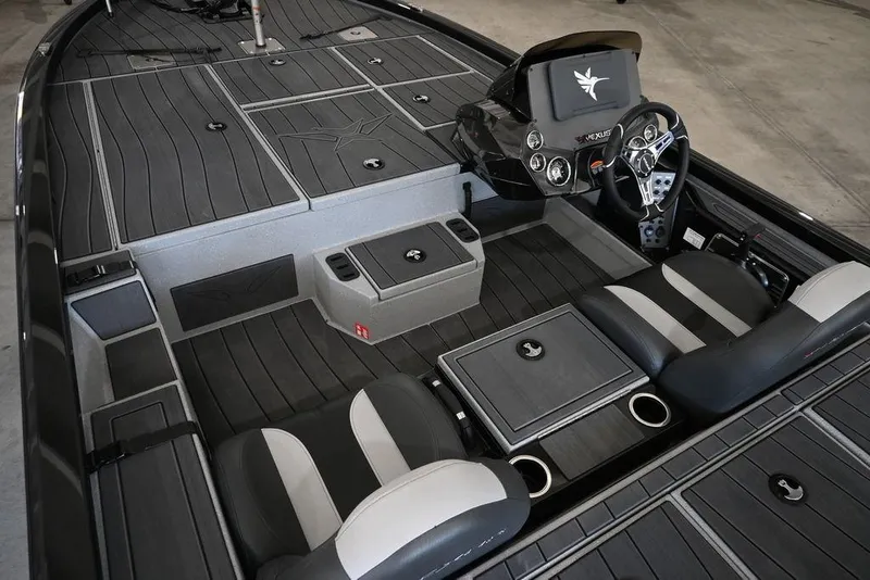 Slide: The Image of 2026 Vexus AVX 1880c boat interior with sleek seating and modern dashboard design. - 2