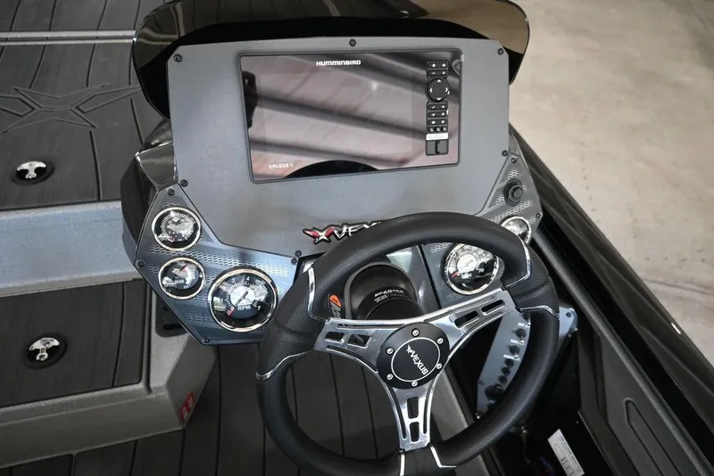 Slide: The Image of 2026 Vexus AVX 1880c boat dashboard with steering wheel and electronic display. - 6