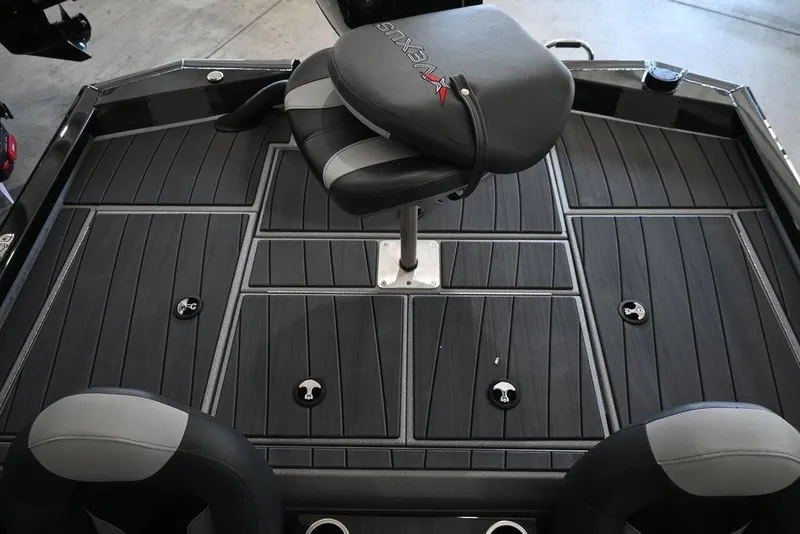 Slide: The Image of 2026 Vexus AVX 1880c boat interior with sleek black seating and deck design. - 7