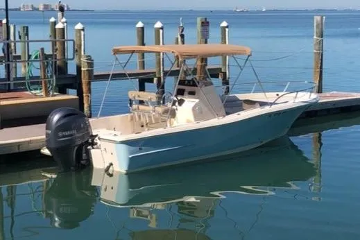 The Image of 2015 Pioneer 220 Bay Sport boat docked with Yamaha outboard motor. - 0