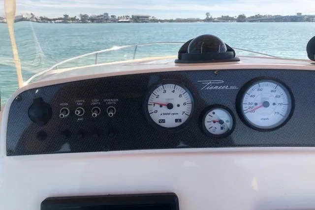Slide: The Image of Dashboard of 2015 Pioneer 220 Bay Sport boat with gauges and controls. - 18