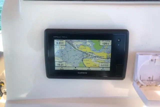 Slide: The Image of Garmin GPS display on 2015 Pioneer 220 Bay Sport boat dashboard. - 19