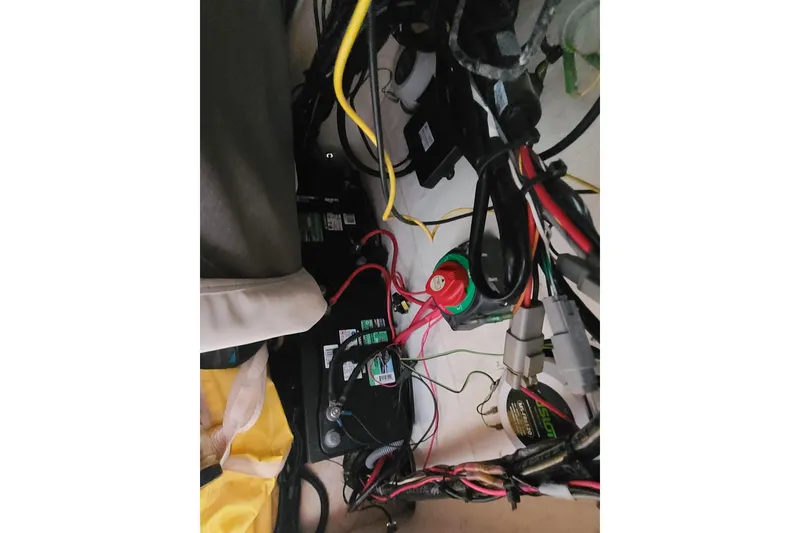 Slide: The Image of Electrical wiring and components inside a 2015 Pioneer 220 Bay Sport boat. - 22