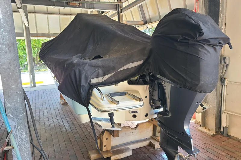 Slide: The Image of Covered 2015 Pioneer 220 Bay Sport boat stored on wooden blocks. - 29