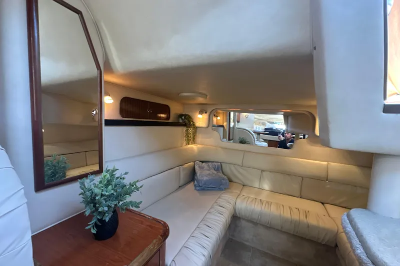Slide: The Image of Interior of 2000 Sea Ray 340 Sundancer yacht with cozy seating and elegant decor. - 35