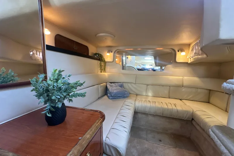 Slide: The Image of Luxurious interior of 2000 Sea Ray 340 Sundancer with plush seating and elegant decor. - 36