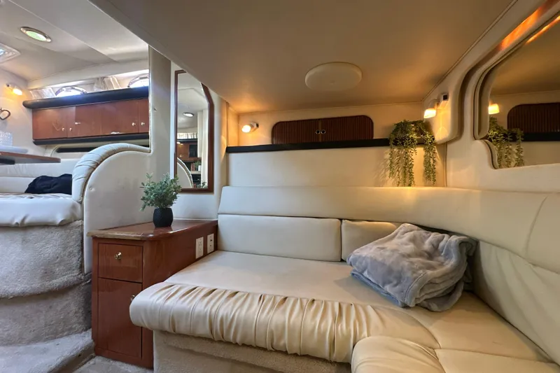Slide: The Image of Luxurious interior of 2000 Sea Ray 340 Sundancer yacht with cozy seating and elegant decor. - 38