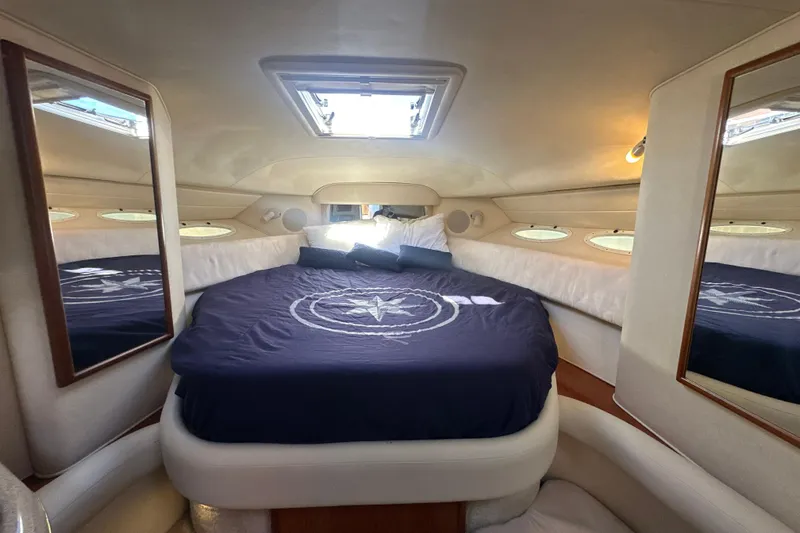 Slide: The Image of Interior cabin of 2000 Sea Ray 340 Sundancer with bed and mirrors. - 41