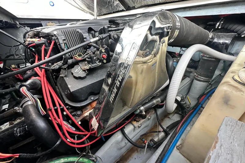 Slide: The Image of Engine compartment of a 2000 Sea Ray 340 Sundancer with visible wiring and components. - 46