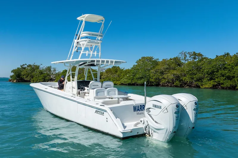 Slide: The Image of 2019 Jupiter 38 HFS boat with dual Yamaha engines on clear water. - 100
