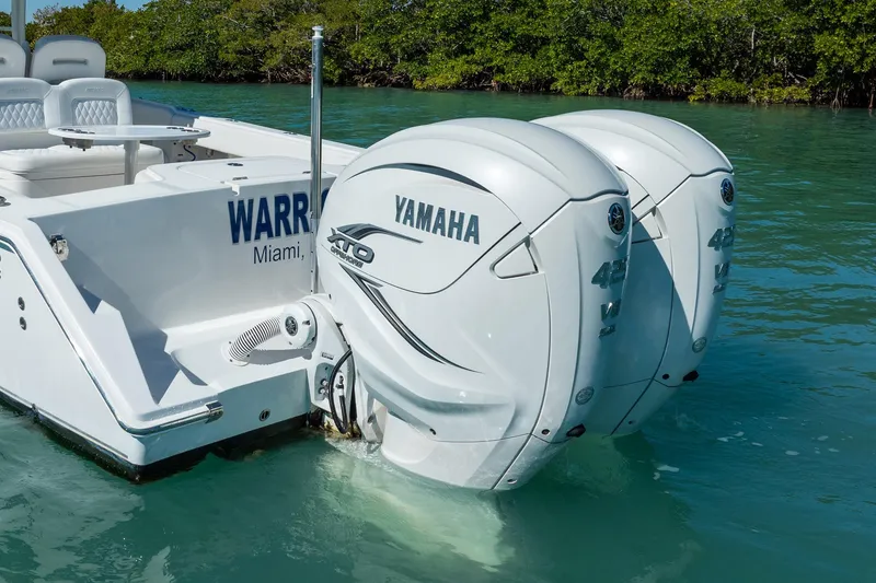 Slide: The Image of 2019 Jupiter 38 HFS boat with twin Yamaha 425 XTO outboard engines in clear water. - 102