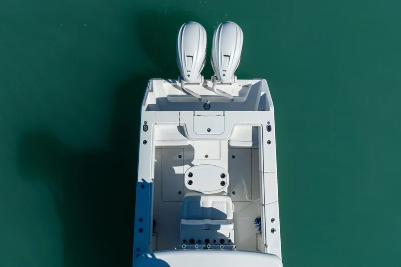 Slide: The Image of Overhead view of 2019 Jupiter 38 HFS boat with dual engines on turquoise water. - 18