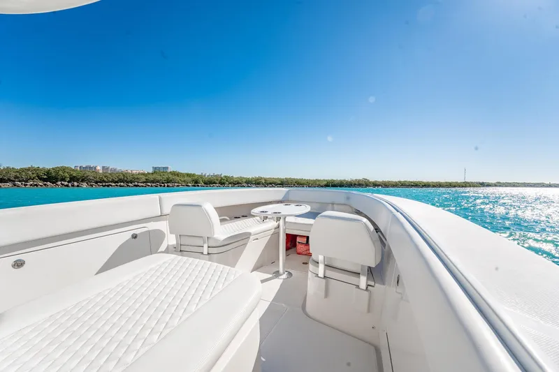 Slide: The Image of 2019 Jupiter 38 HFS boat interior with seating, table, and ocean view. - 20