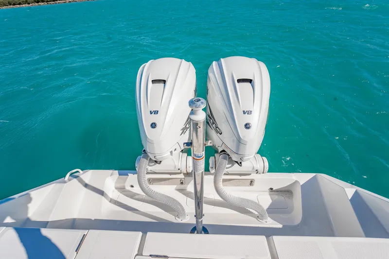 Slide: The Image of 2019 Jupiter 38 HFS boat with twin V8 engines on turquoise water. - 28