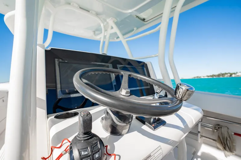 Slide: The Image of Steering console of 2019 Jupiter 38 HFS boat with ocean view. - 35