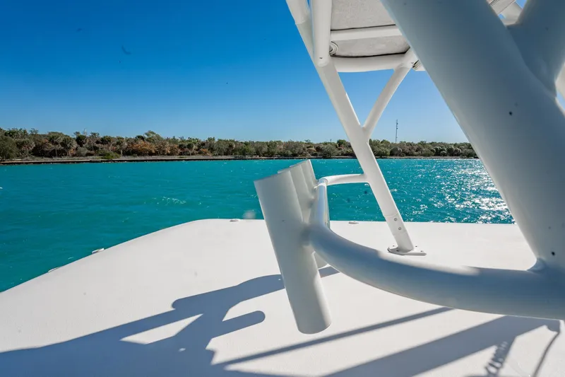Slide: The Image of 2019 Jupiter 38 HFS boat on turquoise water under clear blue sky. - 43