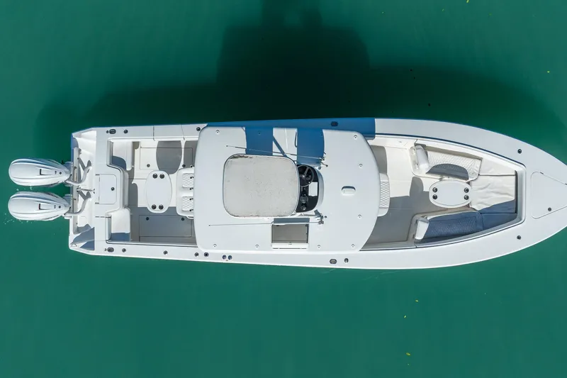 Slide: The Image of Overhead view of 2019 Jupiter 38 HFS boat on clear turquoise water. - 49