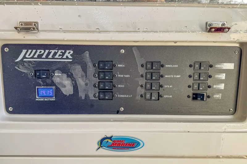 Slide: The Image of Control panel of 2019 Jupiter 38 HFS boat with various switches and battery display. - 55