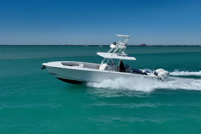 Slide: The Image of 2019 Jupiter 38 HFS boat cruising on turquoise ocean waters. - 72
