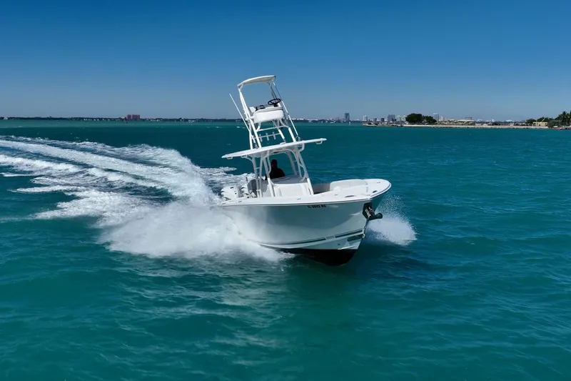 Slide: The Image of 2019 Jupiter 38 HFS boat cruising on clear blue water. - 8