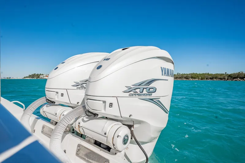 Slide: The Image of 2019 Jupiter 38 HFS boat with Yamaha XTO Offshore engines on turquoise water. - 91