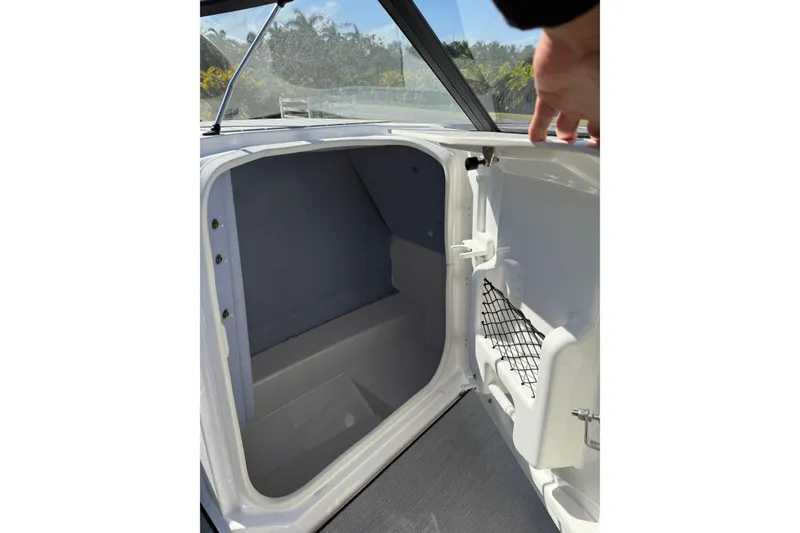 Slide: The Image of Open storage compartment in 2024 Yamaha SX 250 boat, showcasing interior space and design. - 19