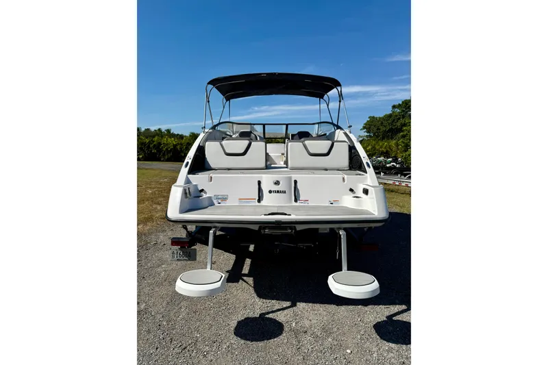 Slide: The Image of 2024 Yamaha SX 250 boat rear view with swim platform and seating. - 26