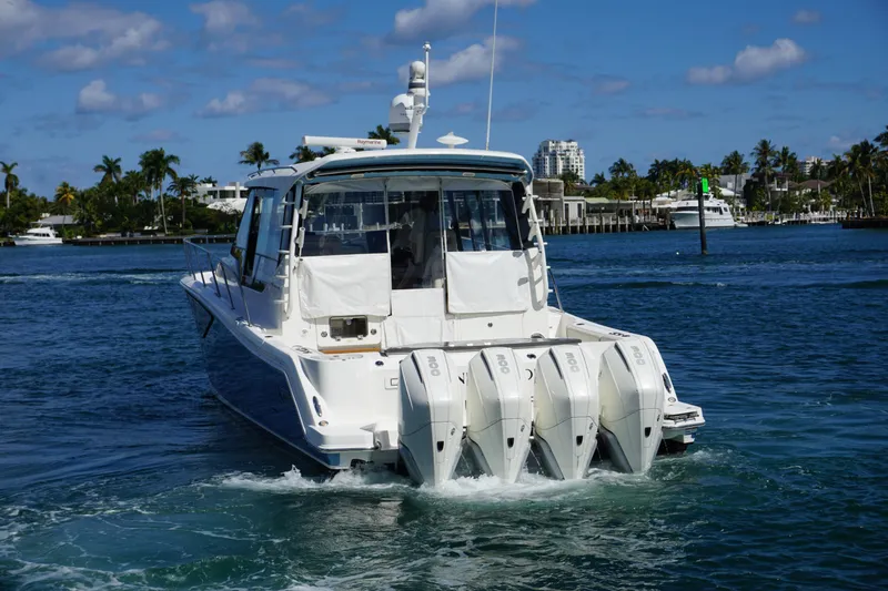 Slide: The Image of 2021 Boston Whaler 405 Conquest boat cruising on a sunny day. - 10