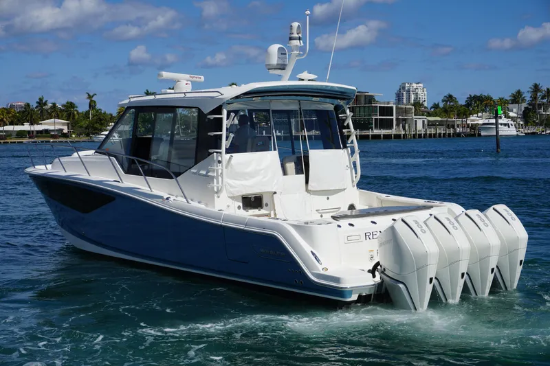 Slide: The Image of 2021 Boston Whaler 405 Conquest boat cruising on a sunny day. - 12