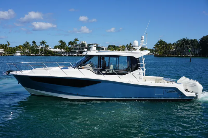 Slide: The Image of 2021 Boston Whaler 405 Conquest boat cruising on a sunny day. - 19